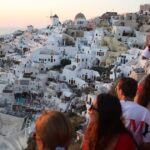 Greece’s Santorini bursts with tourists as locals call for a cap on visitors