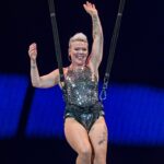 Pink pushes through aerial performance after injuring knee during concert