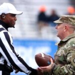 College football referee interrupts penalty call to salute military veterans during Celebration Bowl