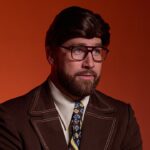 Travis Kelce pulls off hilarious Ron Burgundy-inspired skit in latest ad